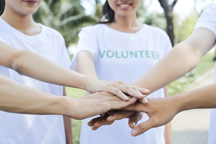 Volunteers standing in a circle